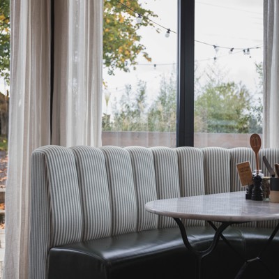 Fluted Booth Seating Within a Café