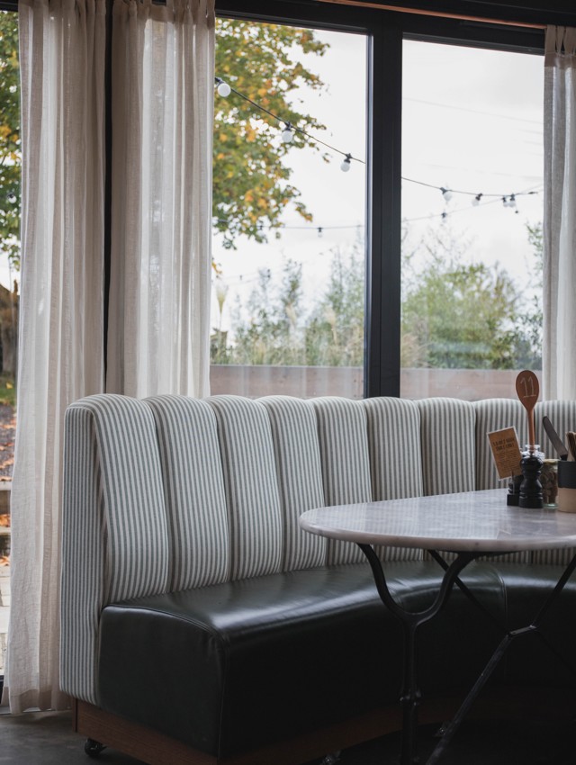 Fluted Booth Seating Within a Café