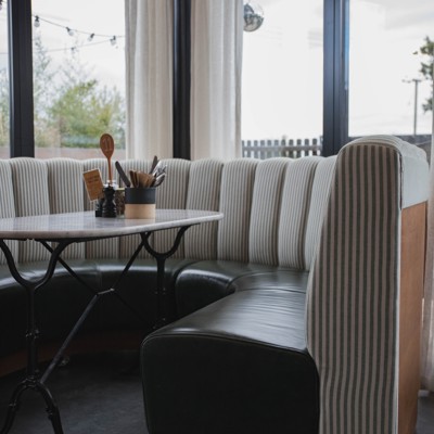 Fluted Booth Seating Within a Café