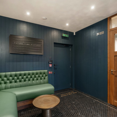 Deep Button Back Banquette in Green Leather