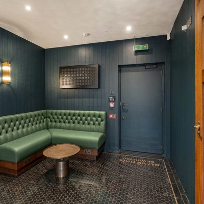 Deep Button Back Banquette in Green Leather