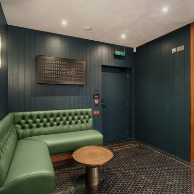 Deep Button Back Banquette in Green Leather